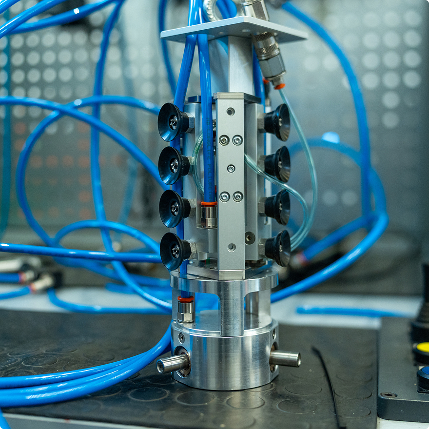 C-GRS vacuum gripper lifting an irradiated graphite block with spiked suction cups
