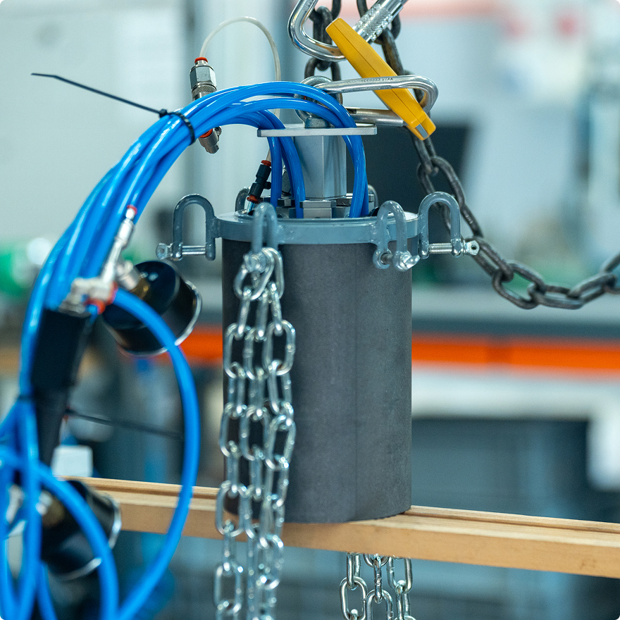 C-GRS system performing controlled 3D handling of a graphite block on a robotic platform